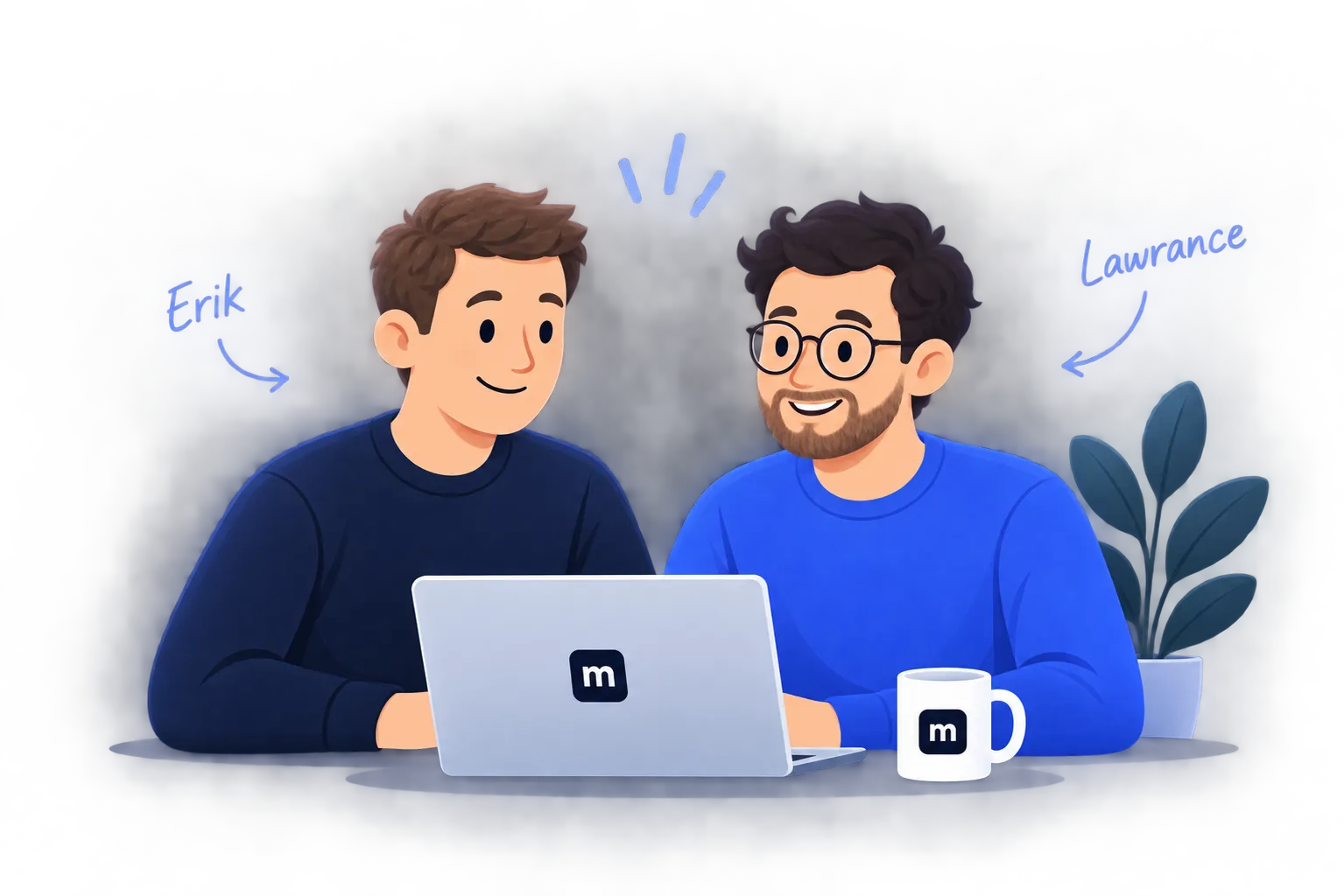 Erik and Lawrance working together at a laptop