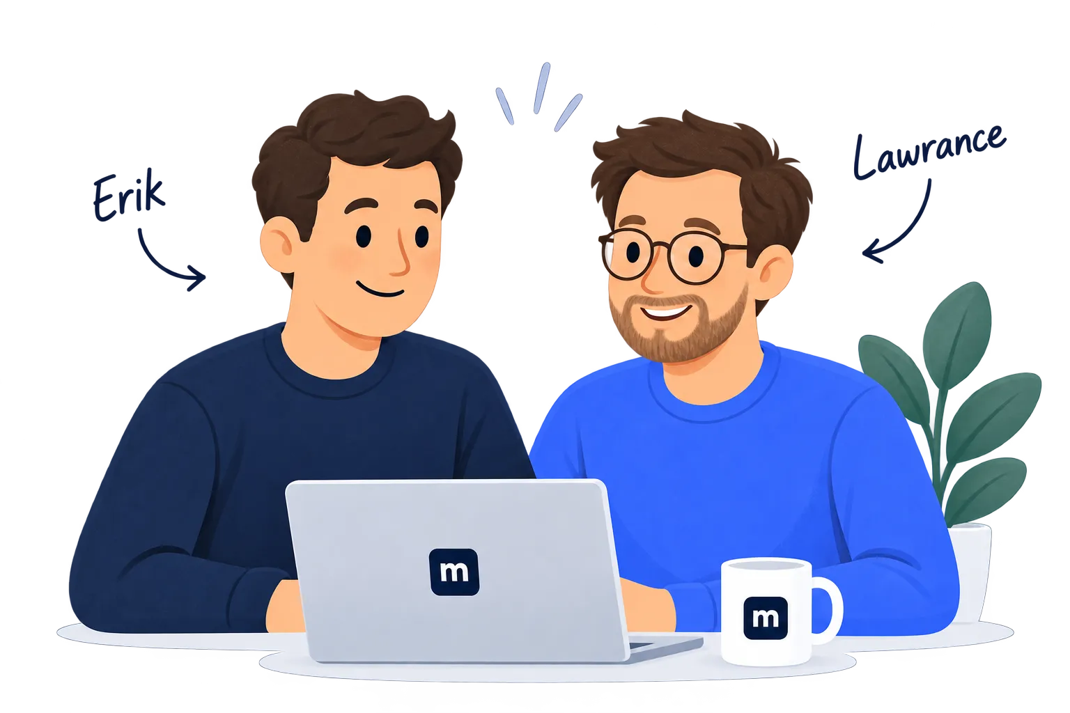 Erik and Lawrance working together at a laptop
